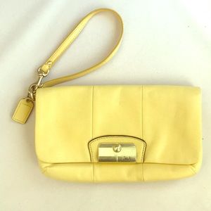 Coach yellow leather clutch